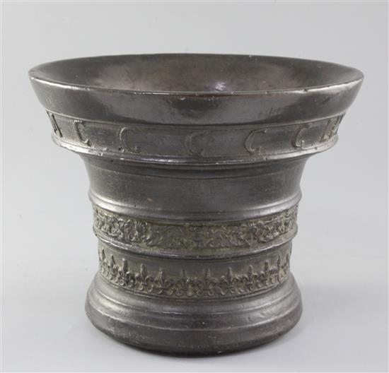 A Flemish bronze mortar, by Jan van den Ghein II, Malines, dated 1559, height 8in.